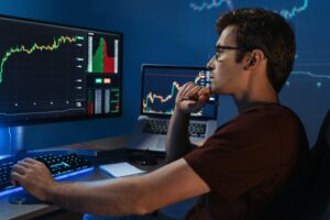 Smart crypto expert analyzing trading market chart, adjusting strategy of investments